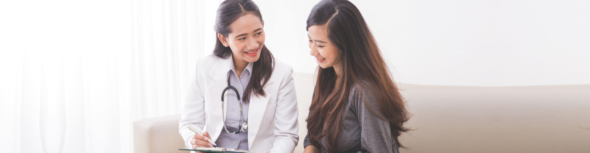 adult woman talking to a medical professional